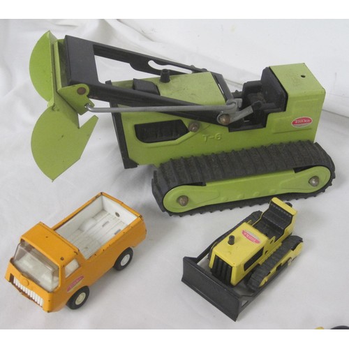 42 - A selection of Tonka toy model trucks including a smaller scale Articulated low loader all as per pi... 