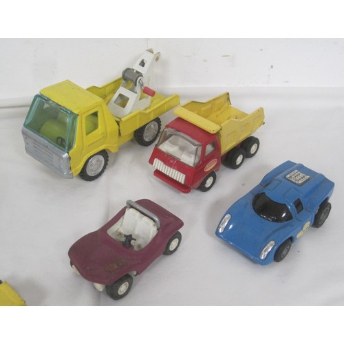 42 - A selection of Tonka toy model trucks including a smaller scale Articulated low loader all as per pi... 