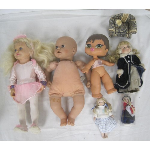 29 - Two boxes of various small and large plastic and decorative dolls, some a/f