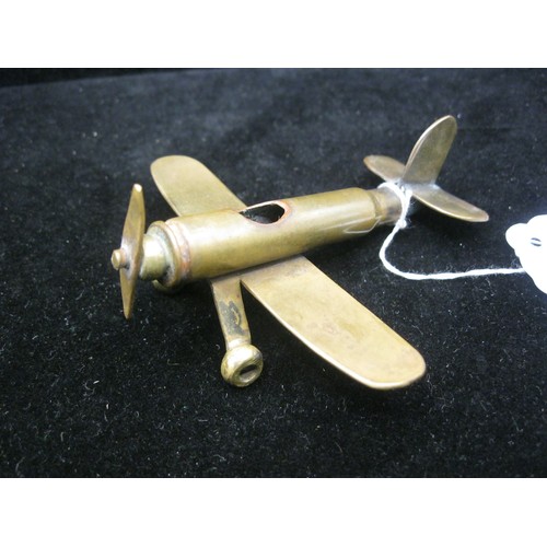 48 - A trench art Monoplane aircraft made from bits of brass with an inert shell case as a fuselage. Wing... 