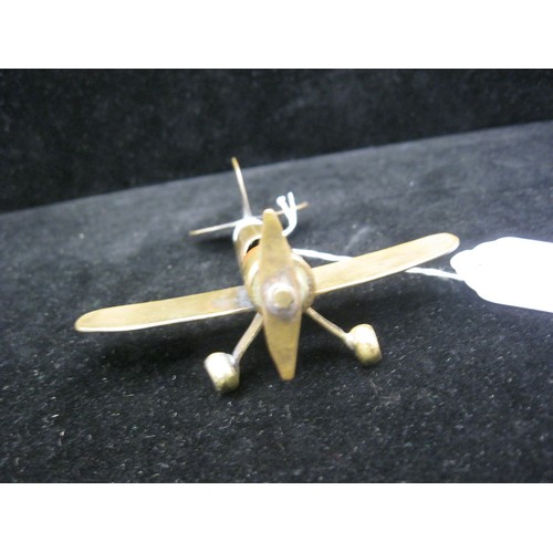 48 - A trench art Monoplane aircraft made from bits of brass with an inert shell case as a fuselage. Wing... 