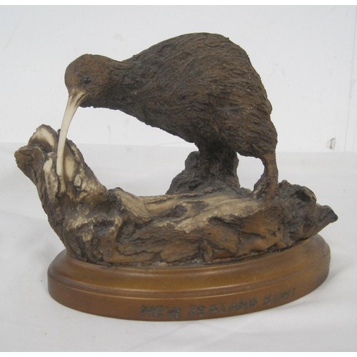 76 - Allan Davey & Co resin figure of kiwi, modelled on a twisted branch on oval base. Title and maker's ... 