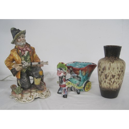 113 - A Capodimonte porcelain figure of hunter with musket, a pottery plant holder modelled as donkey and ... 