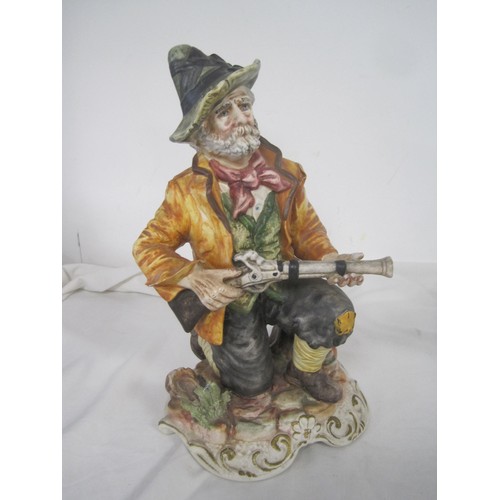 113 - A Capodimonte porcelain figure of hunter with musket, a pottery plant holder modelled as donkey and ... 