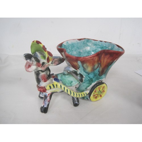 113 - A Capodimonte porcelain figure of hunter with musket, a pottery plant holder modelled as donkey and ... 