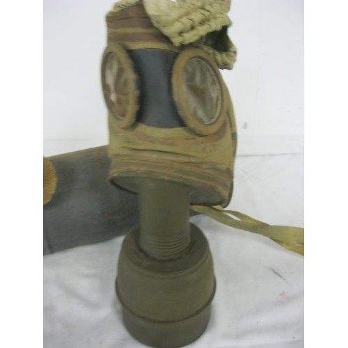 109 - A WW2 French gas mask, complete with original tin, marked C.P.1938-C, in solid overall condition, co... 