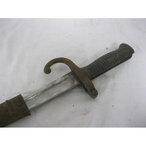 121 - A French 1868 Pattern Chassepot bayonet in scabbard, intact, blade well cared for and oiled, surface... 