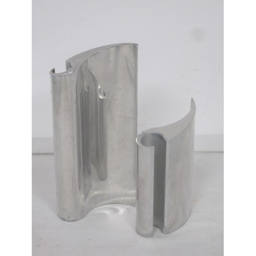 129 - A pair of interesting polished metal table ornaments of abstract swept wave form, standing at 20.5cm... 