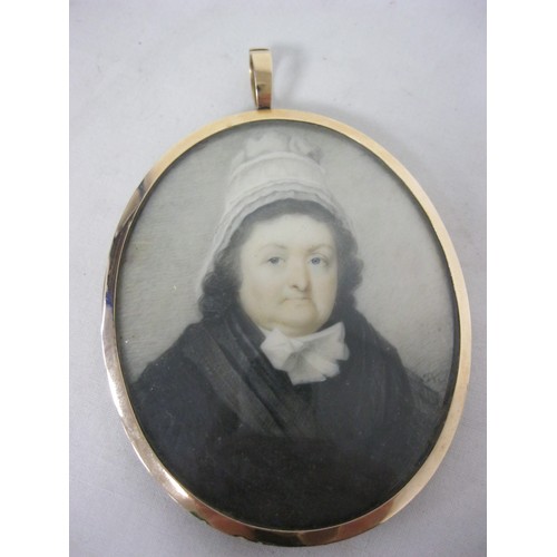 31 - A painted oval memorial portrait miniature onn ivory of woman in black dress and lace bonnet, indist... 