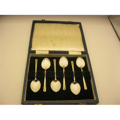 81 - A cased set of six hallmarked silver and enamel coffee spoons, each bowl with white enamel, approxim... 