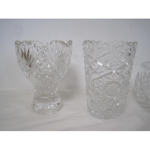 138 - Crystal and glass - a heavy cut vase of open form (height 16cm), a star cut vase, and three bowls, o... 