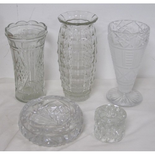 146 - A heavy cut glass ashtray, together with a glass candle holder, and three vases