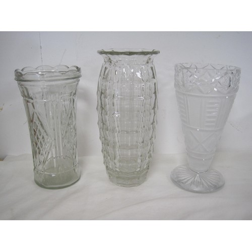 146 - A heavy cut glass ashtray, together with a glass candle holder, and three vases