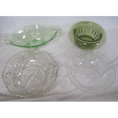 149 - Two green glass bowls, and two clear moulded glass fruit bowls