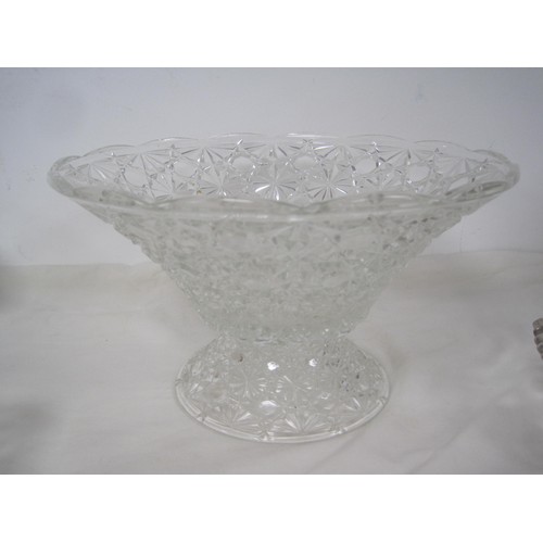 151 - A moulded glass gondola bowl, a footed glass fruit bowl (diameter 26cm), a decoratively moulded plat... 