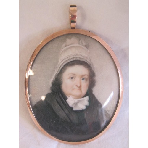 31 - A painted oval memorial portrait miniature onn ivory of woman in black dress and lace bonnet, indist... 