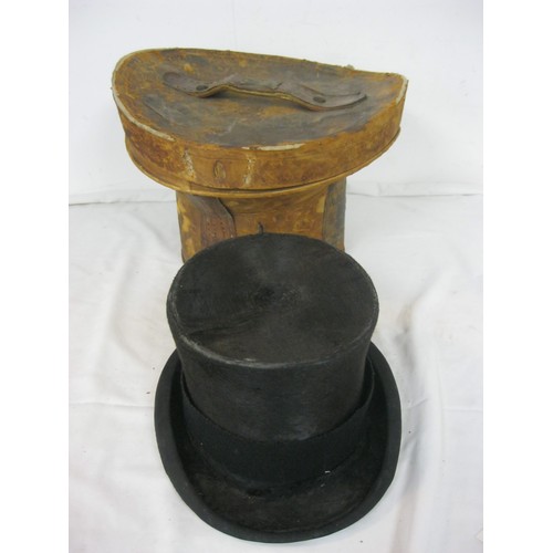 98 - A Victorian leather top hat bucket and contents, ie a hat!