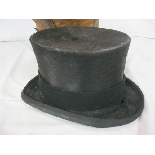 98 - A Victorian leather top hat bucket and contents, ie a hat!