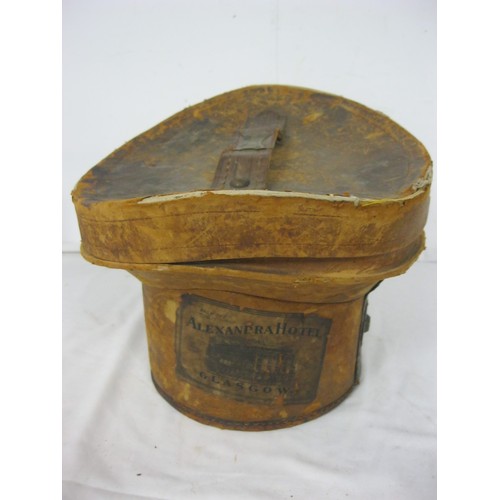 98 - A Victorian leather top hat bucket and contents, ie a hat!