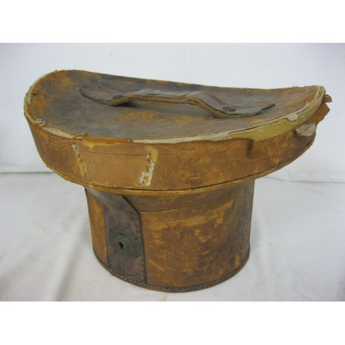 98 - A Victorian leather top hat bucket and contents, ie a hat!