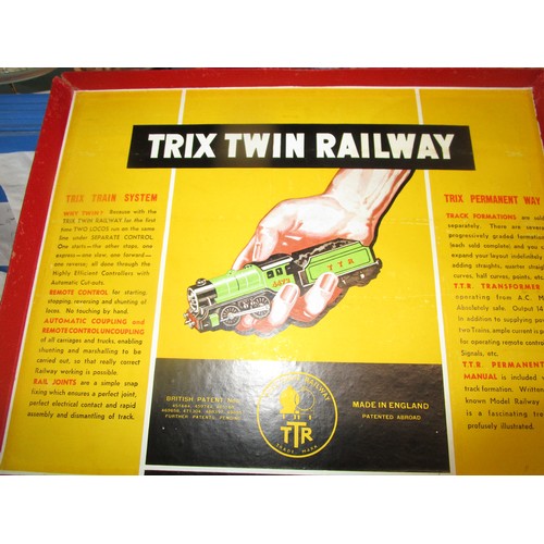 16 - A mint boxed Trix Twin 4 6 2 Britannia loco and tender (bench tested runs well) along with a train s... 