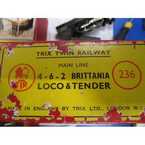 16 - A mint boxed Trix Twin 4 6 2 Britannia loco and tender (bench tested runs well) along with a train s... 