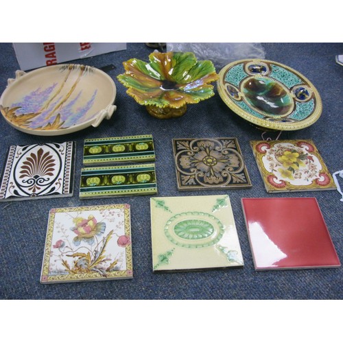 162 - A pair of pieces of Victorian majolica and a selection of antique tiles including Minton's.