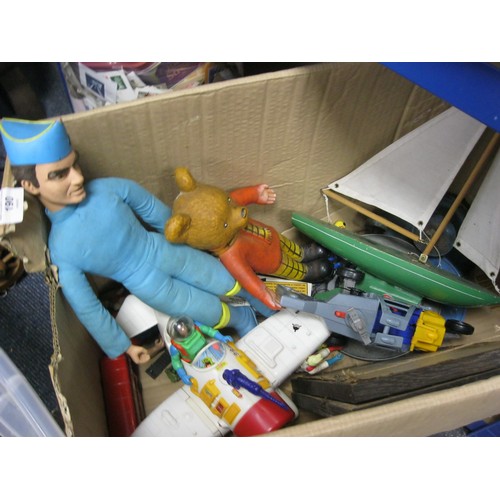 190 - Mixed Box Of Toys To Include Thunderbirds Toy Doll. Rupert Bear Figure. Ghost Busters Airplane & Hel... 