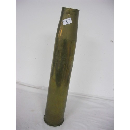 37 - 492 A large brass shell case 59.5cms tall by 12cms diameter at the base, to fire a 7.5cms diameter p... 