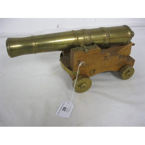 39 - 494 An impressive brass or bronze desk top Signal Cannon. The barrel being 31cms long, with an appro... 