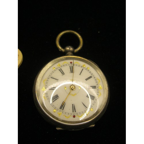 61 - A 935 foreign silver ladies open face pocket watch, enamel dial with gilding and set with two small ... 