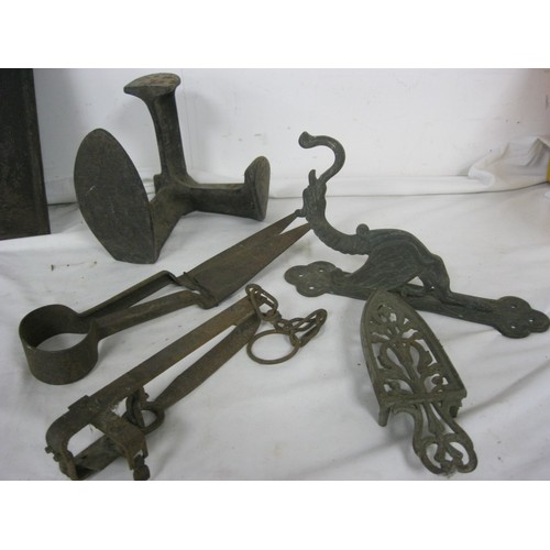 66 - Antique metal items - a gin trap (a/f), a last, a trivet for an iron, antique sheep shears, and a la... 