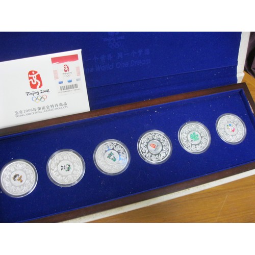 24 - A Beijing 2008 .999 silver proof set of 6 coins, in presentation case, case slight a/f, approx silve... 