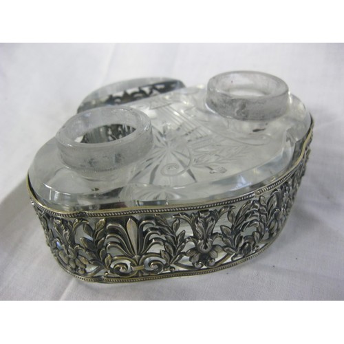 78 - A glass inkwell with silver-plate fittings