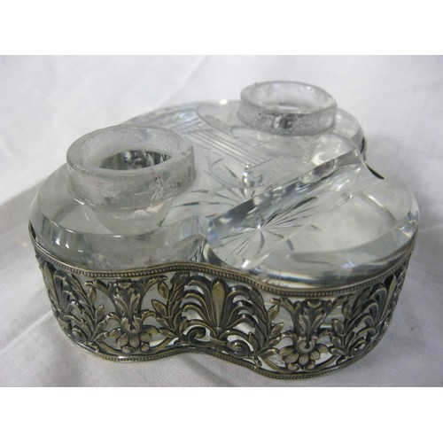 78 - A glass inkwell with silver-plate fittings