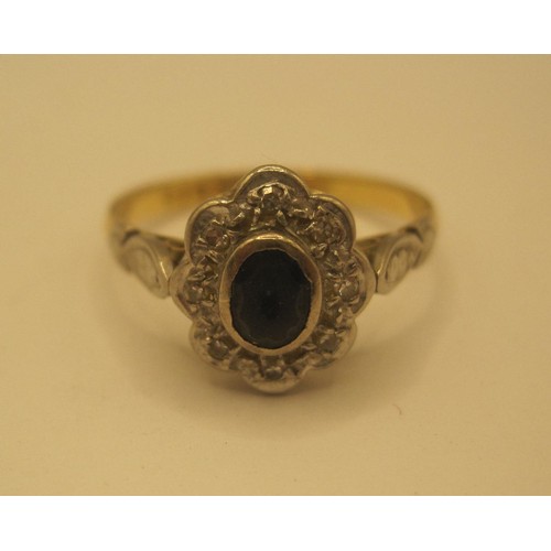 115 - 18ct gold ring with a possible central sapphire size l Total weight 2.5 grams