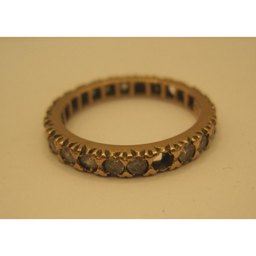 116 - 9ct gold Eternity ring  size M surrounded with low grade diamonds three diamonds missing.
total 2.44... 