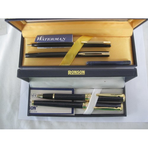 122 - A Waterman fountain pen and ballpoint pen set with black barrels in presentation box, and a Ronson f... 