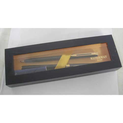 122 - A Waterman fountain pen and ballpoint pen set with black barrels in presentation box, and a Ronson f... 