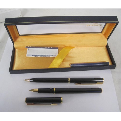 122 - A Waterman fountain pen and ballpoint pen set with black barrels in presentation box, and a Ronson f... 