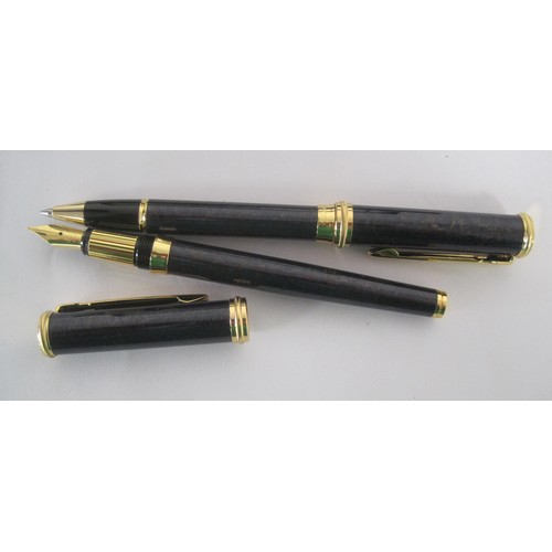 122 - A Waterman fountain pen and ballpoint pen set with black barrels in presentation box, and a Ronson f... 