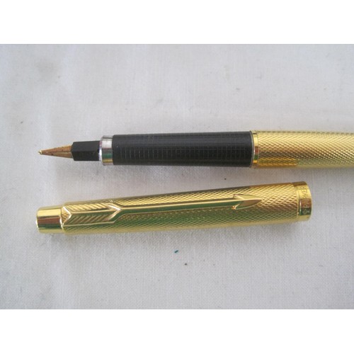 124 - Pens and refills. A Parker slimline gold-plated fountain pen matched with a box; a Parker jotter and... 