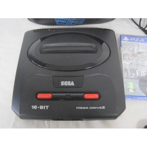 142 - Sega mega drive II with power adaptors, a soft carry case, games and two PS4 football Games. Sega ga... 