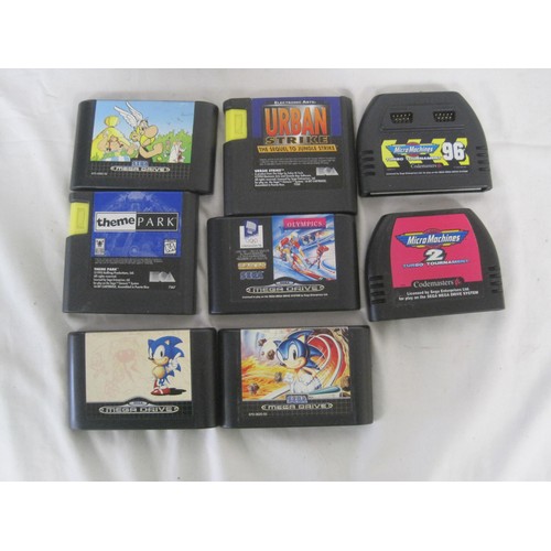 142 - Sega mega drive II with power adaptors, a soft carry case, games and two PS4 football Games. Sega ga... 