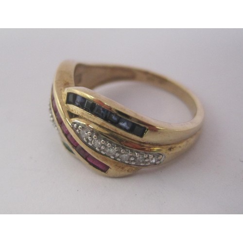 154 - A pretty 9 carat gold dress ring set with crossover lines of small diamonds, rubies, emeralds and sa... 