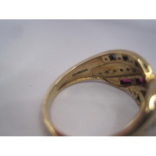 154 - A pretty 9 carat gold dress ring set with crossover lines of small diamonds, rubies, emeralds and sa... 