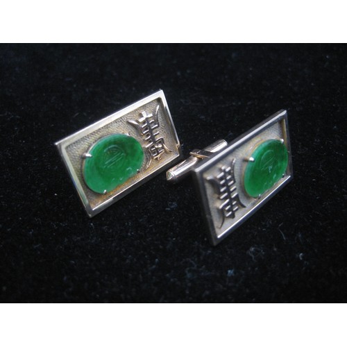 169 - A pair of substantial and distinctive gold cufflinks with gold-plated toggles. The rectangular faces... 