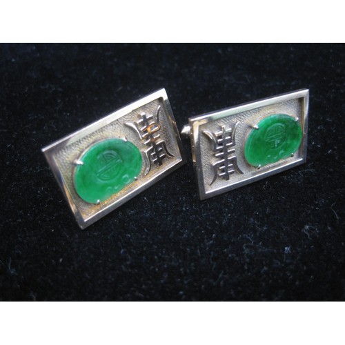 169 - A pair of substantial and distinctive gold cufflinks with gold-plated toggles. The rectangular faces... 