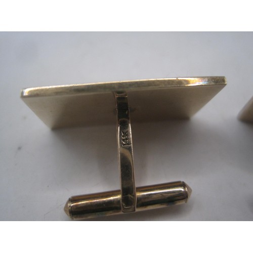 169 - A pair of substantial and distinctive gold cufflinks with gold-plated toggles. The rectangular faces... 