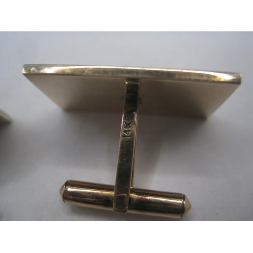 169 - A pair of substantial and distinctive gold cufflinks with gold-plated toggles. The rectangular faces... 